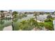 Waterfront with dock, lush greenery, and serene views of the water at 17404 1St E St, Redington Shores, FL 33708