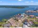 Aerial view showcasing waterfront home, private boat dock, and neighborhood at 1843 Bayou Grande Ne Blvd, St Petersburg, FL 33703