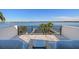 Relaxing waterfront balcony featuring comfortable seating and panoramic views of the water and beyond at 1843 Bayou Grande Ne Blvd, St Petersburg, FL 33703