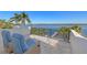 Inviting balcony featuring two chairs and stunning waterfront views, perfect for relaxation and enjoying the scenery at 1843 Bayou Grande Ne Blvd, St Petersburg, FL 33703
