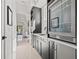 Stylish bar area with custom cabinets, wine cooler, and modern sink fixtures at 1843 Bayou Grande Ne Blvd, St Petersburg, FL 33703