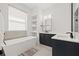 Modern bathroom featuring a soaking tub, dual vanities, and a sleek design at 1843 Bayou Grande Ne Blvd, St Petersburg, FL 33703