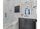 Bathroom featuring sleek vanity, medicine cabinet, and glass enclosed shower at 1843 Bayou Grande Ne Blvd, St Petersburg, FL 33703