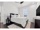 Tastefully designed bedroom with a plush white rug, dark wood floors, and modern furnishings at 1843 Bayou Grande Ne Blvd, St Petersburg, FL 33703
