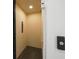 Interior view of a modern residential elevator with light wood paneling and metal accents at 1843 Bayou Grande Ne Blvd, St Petersburg, FL 33703