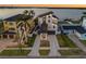 Beautiful modern home aerial view with lush landscaping, private driveways, and coastal neighborhood charm at 1843 Bayou Grande Ne Blvd, St Petersburg, FL 33703