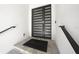 Modern front door with sleek horizontal windows and dark metal hardware at 1843 Bayou Grande Ne Blvd, St Petersburg, FL 33703