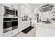 This bright kitchen features stainless steel appliances and light countertops at 1843 Bayou Grande Ne Blvd, St Petersburg, FL 33703