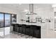 Bright, open kitchen with an island, stainless steel hood, and bar stool seating at 1843 Bayou Grande Ne Blvd, St Petersburg, FL 33703