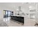 This kitchen offers a large island with black bar stools and stunning views at 1843 Bayou Grande Ne Blvd, St Petersburg, FL 33703