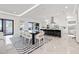 Open-concept kitchen with large island, modern appliances, and seamless flow to dining and living areas at 1843 Bayou Grande Ne Blvd, St Petersburg, FL 33703