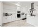 Bright kitchen featuring custom white cabinets and stainless steel appliances at 1843 Bayou Grande Ne Blvd, St Petersburg, FL 33703