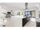 Open-concept kitchen with a large island with range and stunning water views at 1843 Bayou Grande Ne Blvd, St Petersburg, FL 33703