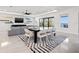 Bright living room and dining area with modern decor, stylish rug, and beautiful view at 1843 Bayou Grande Ne Blvd, St Petersburg, FL 33703