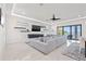 Bright open-concept living room with a modern entertainment center and plenty of seating at 1843 Bayou Grande Ne Blvd, St Petersburg, FL 33703