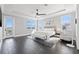 Airy main bedroom with a bay view, modern furniture, tray ceiling and stylish ceiling fan at 1843 Bayou Grande Ne Blvd, St Petersburg, FL 33703
