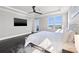 Bright main bedroom with water view, dark wood floors, and access to balcony at 1843 Bayou Grande Ne Blvd, St Petersburg, FL 33703