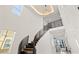 Modern staircase with high ceilings, natural light, and an open concept design for a luxurious feel at 1843 Bayou Grande Ne Blvd, St Petersburg, FL 33703