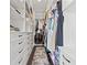 Organized walk-in closet with ample shelving and storage space for clothing at 1843 Bayou Grande Ne Blvd, St Petersburg, FL 33703