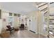 Inviting entryway with spiral staircase, hardwood floors and sunlit windows at 235 1/2 17Th Ave Se Se Ave, St Petersburg, FL 33701