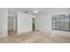 Bright, empty bedroom with a walk-in closet and a ceiling fan at 2446 Bentley Dr, Palm Harbor, FL 34684