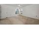 Comfortable bedroom with neutral walls, soft carpet, and a window for natural light, creating a relaxing atmosphere at 2446 Bentley Dr, Palm Harbor, FL 34684