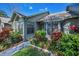 Charming home exterior showcasing lush landscaping and well-maintained curb appeal at 2446 Bentley Dr, Palm Harbor, FL 34684
