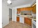 Kitchen featuring tile flooring, practical design, and a view to the adjacent rooms, creating a seamless flow at 2446 Bentley Dr, Palm Harbor, FL 34684