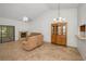 Bright living room with tiled flooring, fireplace, china cabinet, and sliding glass doors at 2446 Bentley Dr, Palm Harbor, FL 34684