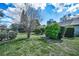 Well-maintained yard featuring manicured shrubs and lush green grass at 2446 Bentley Dr, Palm Harbor, FL 34684