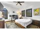 Bedroom featuring carpeted floors, a ceiling fan, and windows with shutters at 2810 W Wyoming Ave, Tampa, FL 33611