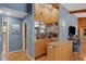 Stylish bar area with mirrored shelving, wood paneling, and backyard access at 3137 Valemoor Dr, Palm Harbor, FL 34685