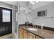 Well-lit bathroom features a walk-in shower, granite countertop, and ample cabinet space at 3137 Valemoor Dr, Palm Harbor, FL 34685