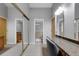 This bathroom features a vanity area with granite counters and an entrance to the water closet at 3137 Valemoor Dr, Palm Harbor, FL 34685