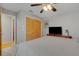 This cozy bedroom offers a ceiling fan, TV, dresser and night stands at 3137 Valemoor Dr, Palm Harbor, FL 34685