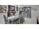 Chic dining room featuring designer lighting, sleek furniture, and a view into other rooms at 3137 Valemoor Dr, Palm Harbor, FL 34685