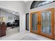 Bright foyer with tile flooring and view into office at 3137 Valemoor Dr, Palm Harbor, FL 34685