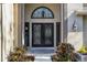 Elegant front door with decorative glass and brick accents at 3137 Valemoor Dr, Palm Harbor, FL 34685