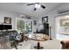 This home office features a Liberty safe, a vintage table, and a comfortable desk space at 3137 Valemoor Dr, Palm Harbor, FL 34685