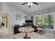 Functional home office with natural light, window shutters, and ample desk space at 3137 Valemoor Dr, Palm Harbor, FL 34685