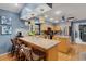 Stylish kitchen with barstool seating, granite countertops, stainless steel appliances and pendant lighting at 3137 Valemoor Dr, Palm Harbor, FL 34685