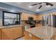 Bright kitchen with stainless steel appliances, granite countertops and a convenient center island for meal preparation at 3137 Valemoor Dr, Palm Harbor, FL 34685
