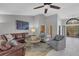 Open living room with vaulted ceiling, ceiling fan, stylish furniture and decor at 3137 Valemoor Dr, Palm Harbor, FL 34685