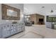 Open-concept living room with tile floors and stone accent wall at 3137 Valemoor Dr, Palm Harbor, FL 34685