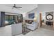 Living room featuring tile floors, a ceiling fan, and pool views at 3137 Valemoor Dr, Palm Harbor, FL 34685
