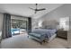 Bright main bedroom with sliding glass doors to the lanai and pool at 3137 Valemoor Dr, Palm Harbor, FL 34685