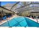 Backyard pool with an enclosed patio, and plenty of seating, perfect for outdoor living at 3137 Valemoor Dr, Palm Harbor, FL 34685