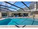 Inviting pool with ample seating and lounging areas for outdoor enjoyment and entertaining at 3137 Valemoor Dr, Palm Harbor, FL 34685
