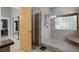The glass enclosed shower features dual shower heads and a bench seat at 3137 Valemoor Dr, Palm Harbor, FL 34685