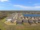 Aerial view of a neighborhood with water views and backyard pools at 3148 Marine Grass Dr, Wimauma, FL 33598